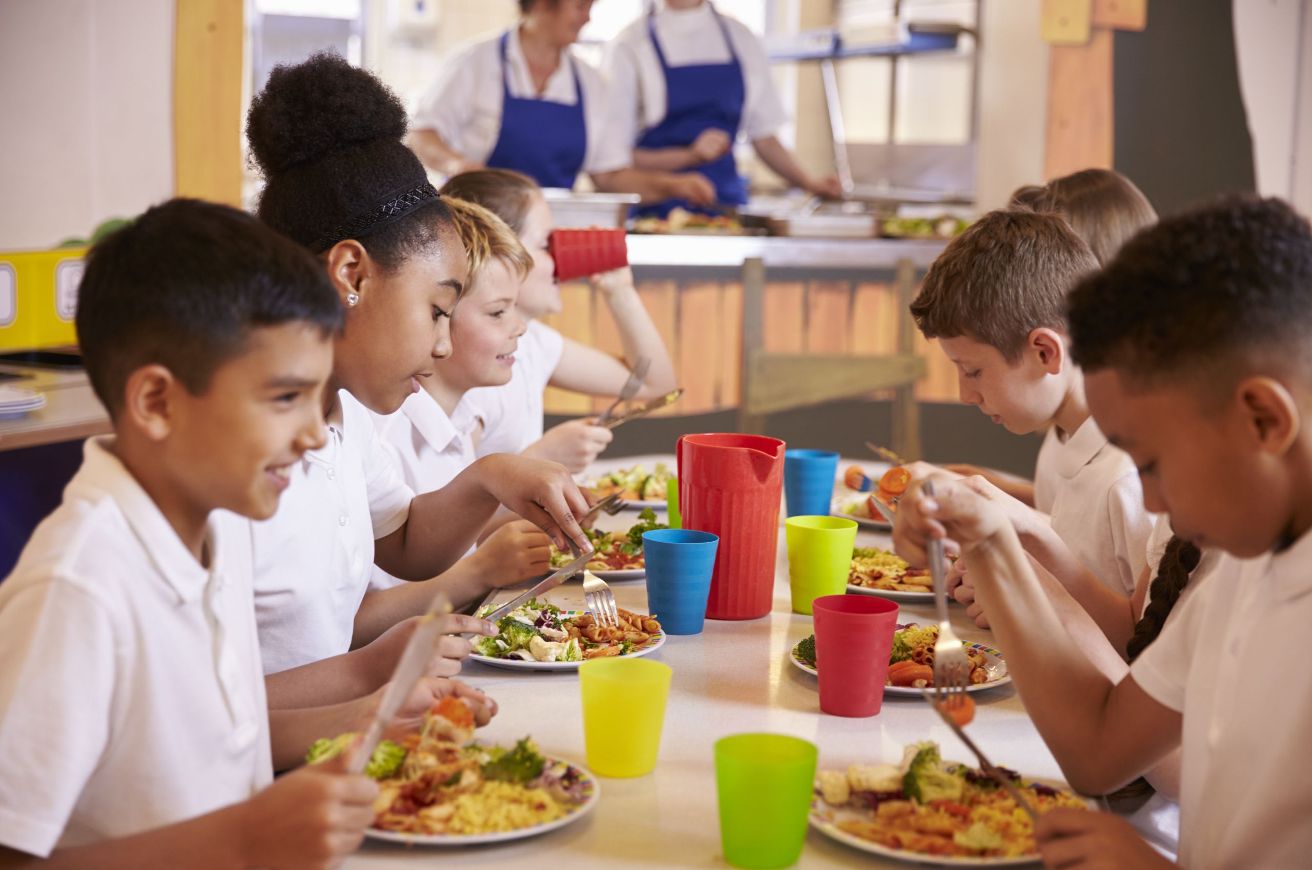 primary school kids eating table school cafeteria school Catering Kitchen Services Lancashire